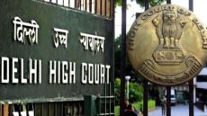 Image of a Board outside the DHC that reads 'Delhi High Court'