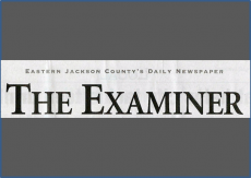 A newspaper cutting saying 'The Examiner'